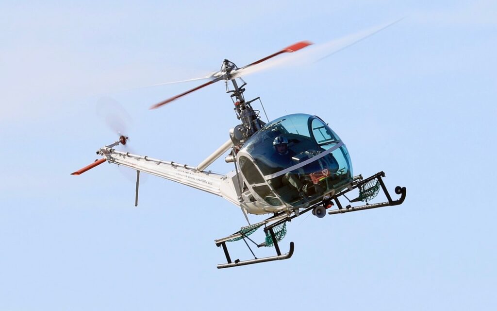 Simon Spencer-Bower flying the Hiller 12E Helicopter at Warbirds over Wanaka 2024